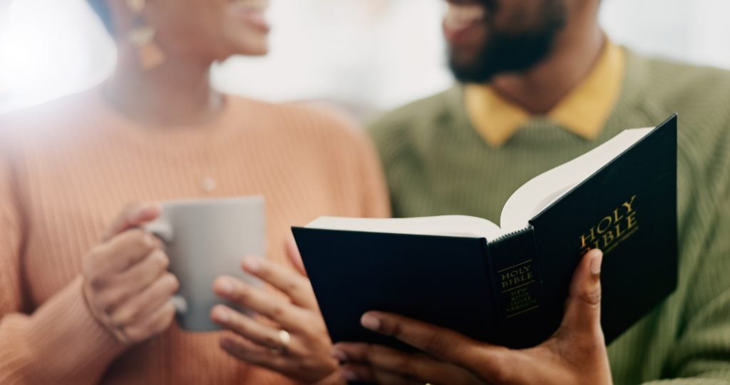 Couple reading the Bible together.