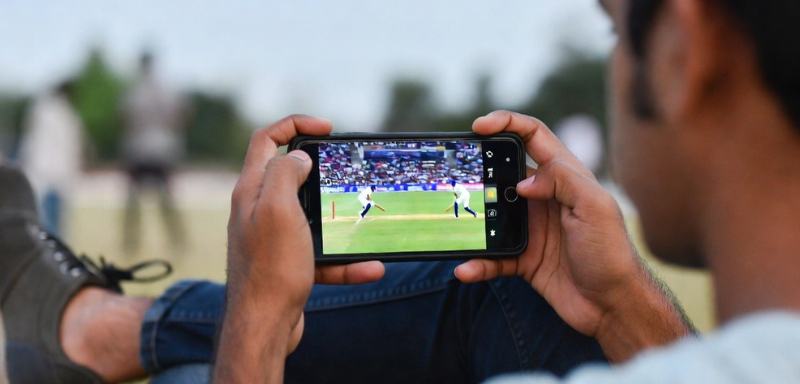 Fan watching cricket online for free.